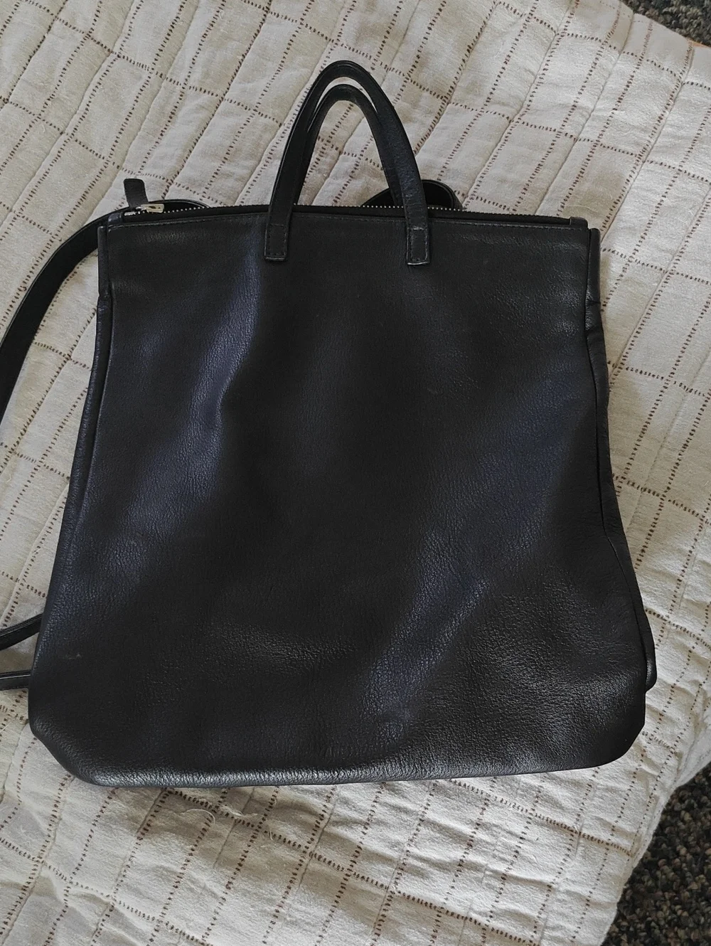 Are Studio leather Tote Backpack